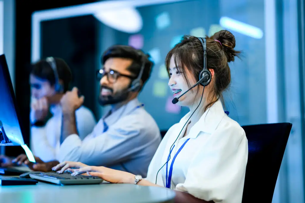 a diverse team of technical support specialists works a late shi